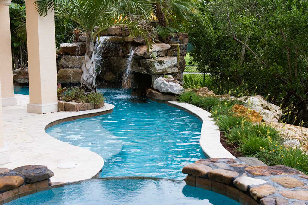 Lagoon Pool with Tennessee field stone grotto and spa designed and built on Siesta Key, Florida by Lucas Lagoons Inc