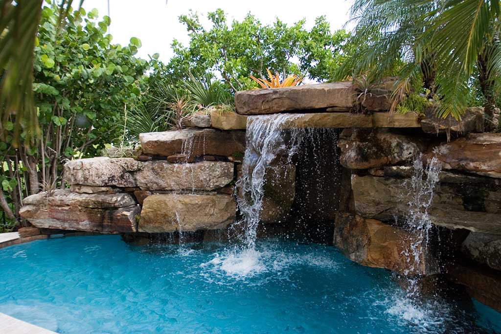 Lagoon Pool with Tennessee field stone grotto and spa designed and built on Siesta Key, Florida by Lucas Lagoons Inc