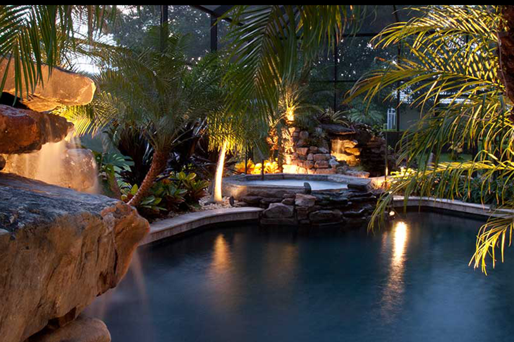 Swimming pool remodel with grotto, spa,waterfalls and a koi pond designed and built by Lucas Lagoons Inc. in Sarasota FL