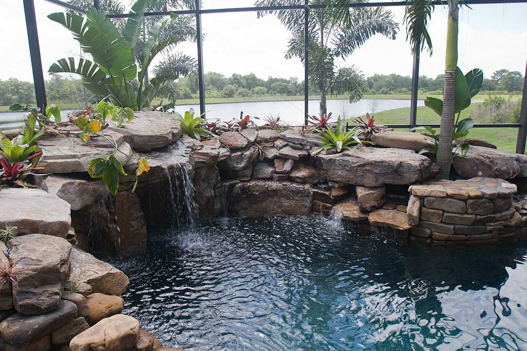 Swimming pool remodel with spa, grotto, multiple water falls by Lucas Lagoons Inc.