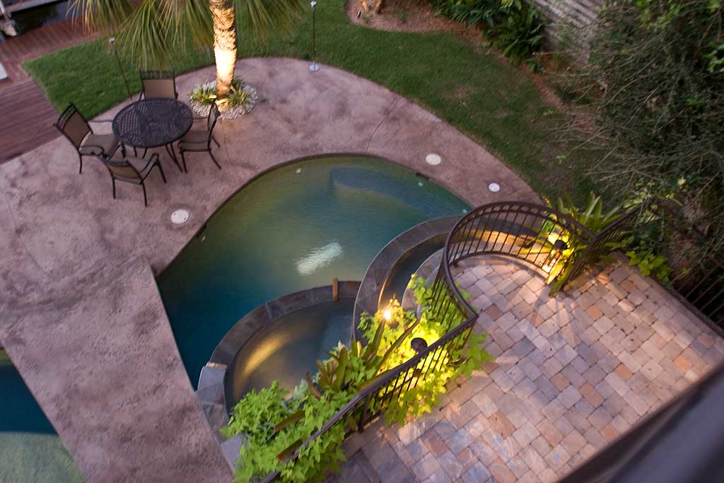 Lagoon pool with spa, bridge, and bar area designed and built in Siesta Key Florida by Lucas Lagoons Inc.