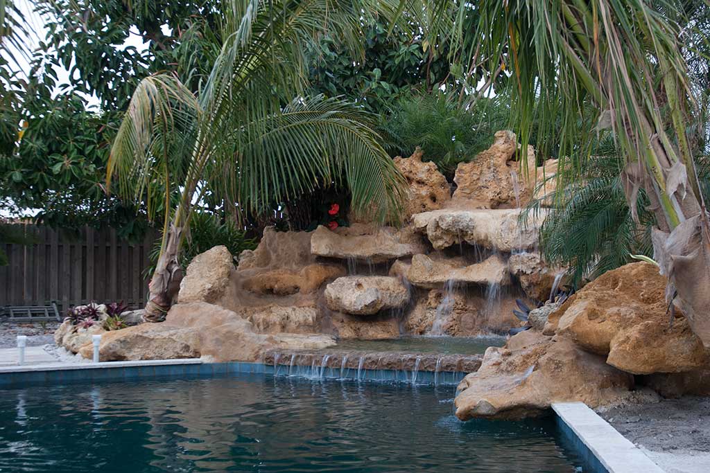 Lagoon Pool remodel with Florida Limestone and multiple waterfalls designed and built in Sarasota Florida by Lucas Lagoons Inc.