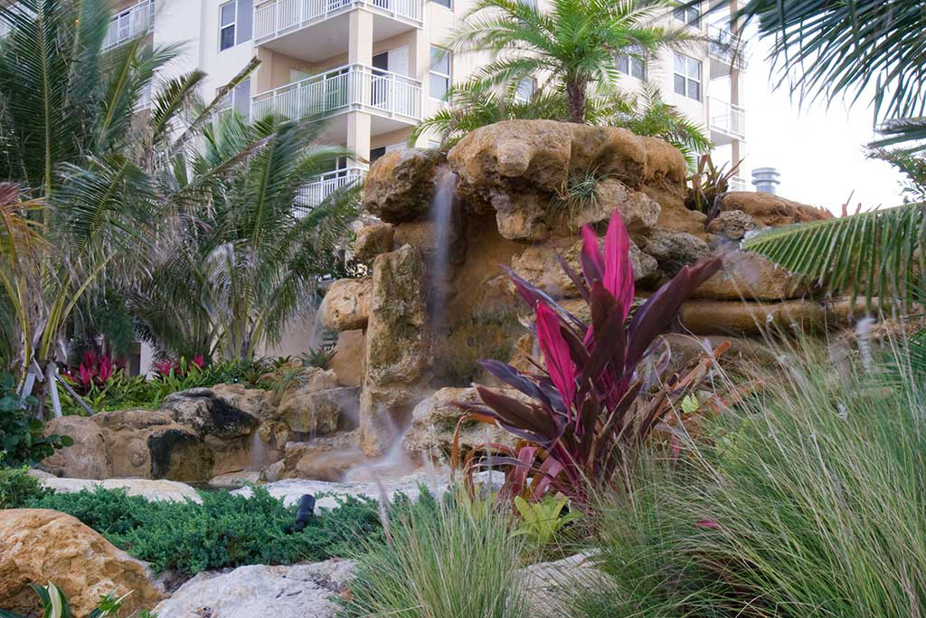 Natural Limestone water feature at entrance to Longboat Key Club by Lucas Lagoons Inc.