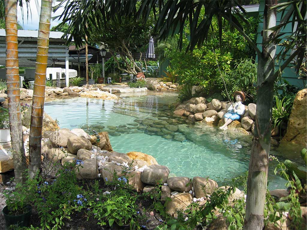 Natural Lagoon Pool with sand bottom built on Siesta Key by Lucas Lagoons Inc.