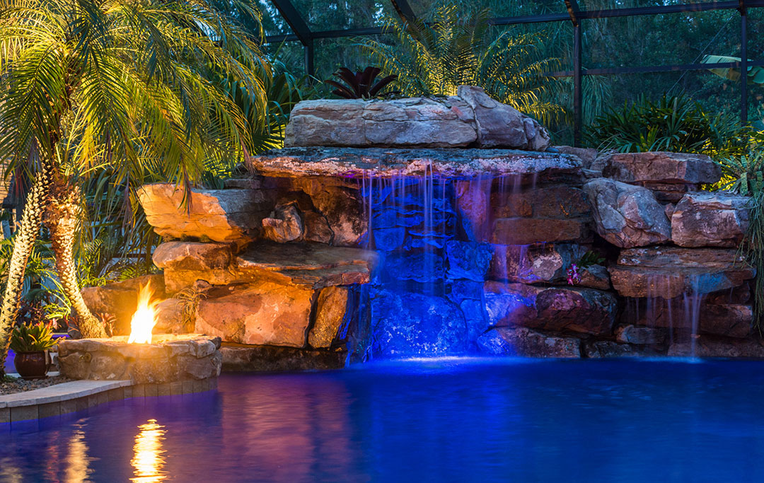 Lagoon pool and zen healing pool with rock grotto, water falls and fire feature designed by Lucas Lagoons and part of the Insane Pool series on Animal Planet