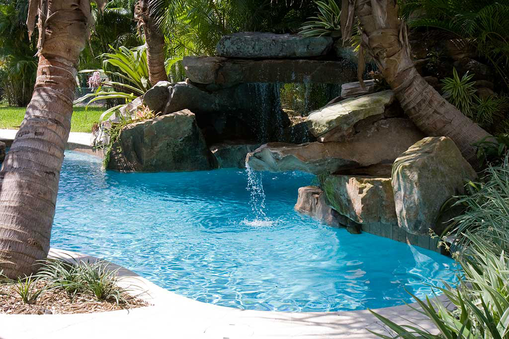 Lagoon pool with Tennessee Field stone grotto, spa and fire feature on Siesta Key, Florida