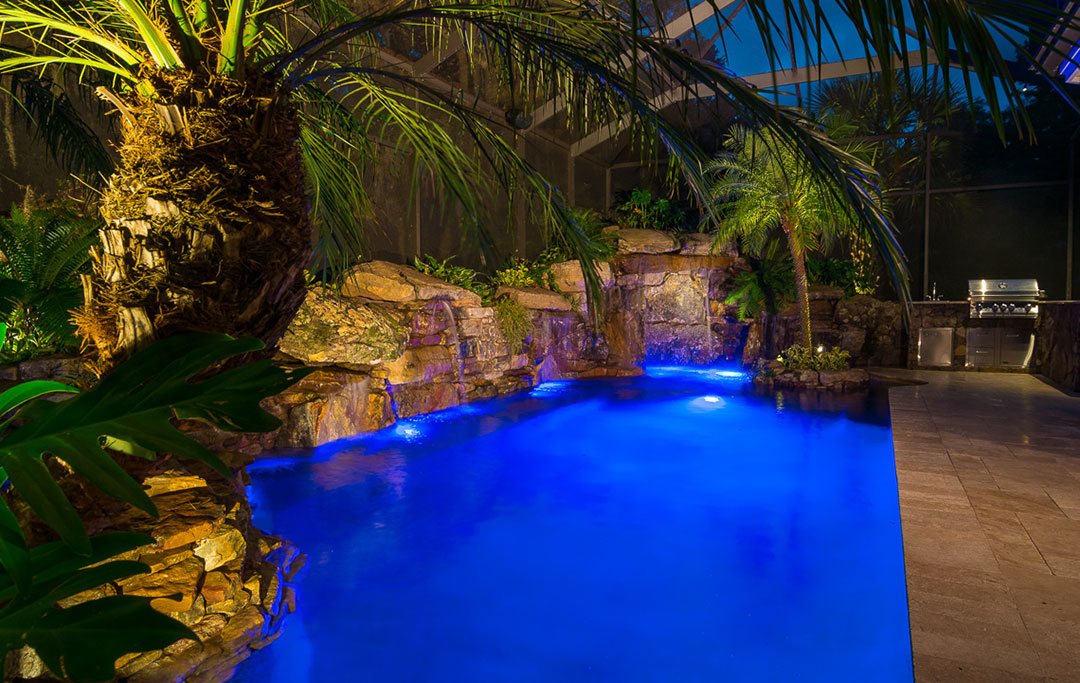 Lucas Lagoon Pool and spa remodel with Waterwalls, Natural Stone grotto and outdoor kitchen designed and built by Lucas Lagoons for the TV show Insane Pools on Animal Planet