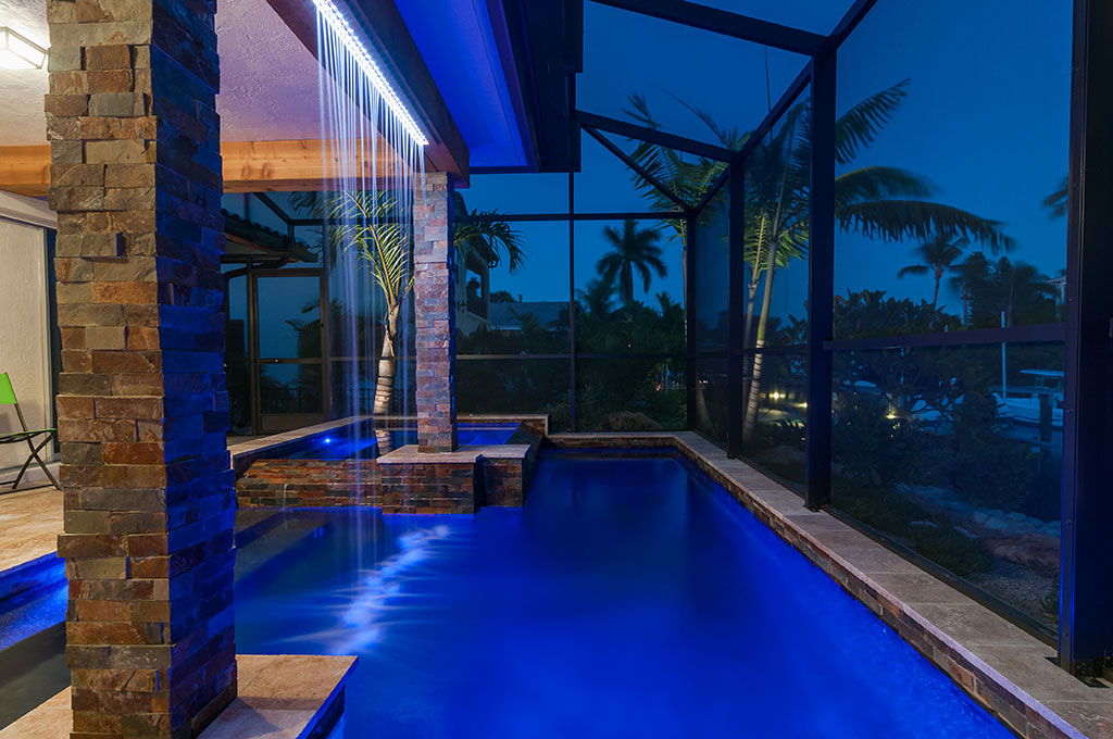 Modern Zen design with rain curtain,  linear design for the spa and pool by Lucas Lagoons Inc.