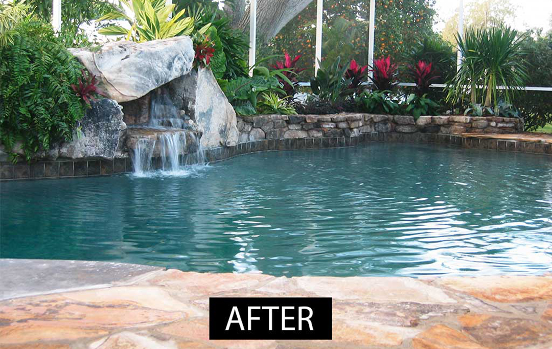 Lagoon pool remodel with small waterfall and stone planters and flagstone designed and built by Lucas Lagoons Inc. in Sarasota, Florida