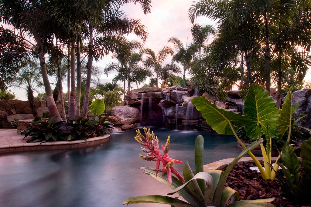 Lagoon pool and spa with natural Tennessee field stone grotto water feature, in Sarasota, Florida designed and built by Lucas Lagoons Inc.