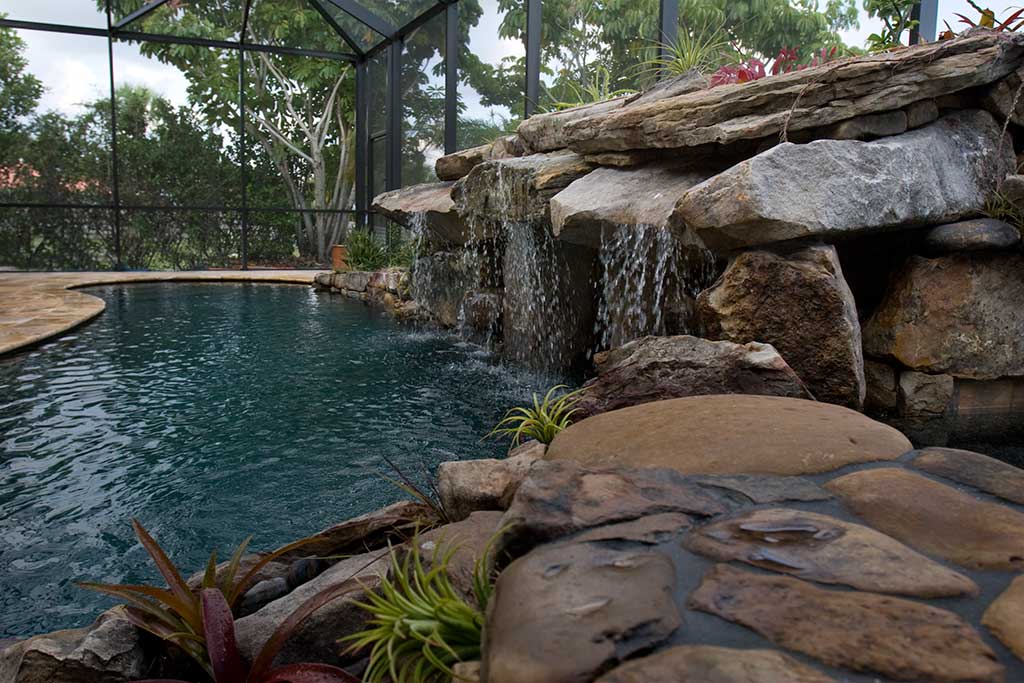 Lagoon swimming pool remodel with Tennessee fieldstone grotto and spa by Lucas Lagoons Inc.